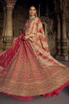 Red can can attached lehenga featuring dabka and dori embroidered vine motifs in chevron pattern, highlighted by beads, sequins, crystals and scallop hem. Comes with padded bead tasselled blouse, shoulder dupatta 1, scallop patterned kiran lined dupatta 2 and scalloped belt. - Aza Fashions Festive V-neck Lehenga With Dupatta, Bollywood Style Lehenga With V-neck Dupatta, Bollywood Style V-neck Lehenga With Dupatta, Designer V-neck Lehenga For Festivals, Traditional V-neck Wedding Gown, Festive Semi-stitched Lehenga With V-neck, V-neck Lehenga With Dupatta For Diwali, Anarkali Style Lehenga With V-neck And Resham Embroidery, Bollywood Style V-neck Lehenga For Diwali