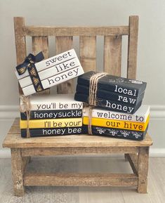 a wooden chair sitting on top of a hard wood floor next to boxes with writing on them