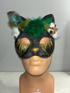 This is a listing for one of my older works, named Emerald! It is a painted cat mask with several different addons including fake moss, fake feathers, fake cotton balls, and faux fur. Note: Because this is one of my older works it does not represent the quality of the work today. That being said it is still on the higher end of medium quality. Buying this masks gives you all of rights to this character! Please credit me with the design and mask, though. If you have any questions, please feel free to reach out!