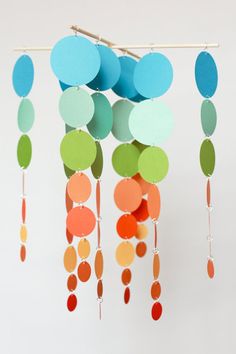 a mobile with circles hanging from it's sides