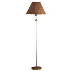 a floor lamp with a brown shade on it