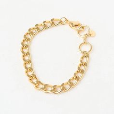 The Fine Grumet Chain Bracelet is a classic and elegant piece that adds a refined touch to your look. Crafted with a fine grumet link chain, this bracelet is gold plated to provide a luxurious shine. The minimalist design of the fine chain makes this bracelet versatile, perfect for daily wear or to complement more formal outfits. Its 16 cm size ensures a comfortable fit on the wrist, making it a timeless and sophisticated choice. The gold plating adds warmth and elegance to the Fine Grumet Chain Bracelet, enhancing the beauty of the grumet links. It’s ideal for those seeking a classic and understated piece of jewelry that adapts effortlessly to various styles and occasions. Wear the Fine Grumet Chain Bracelet alone for a delicate look or layer it with other bracelets to create a more elabo Gold Curb Chain Metal Bracelet, Gold Metal Chain Bracelet With Solid Links, Minimalist Gold Cuban Link Bracelet For Everyday, Gold Metal Curb Chain Bracelet, Classic Gold-tone Chunky Chain Bracelet, Minimalist Gold Metal Chain Bracelet, Classic Gold Plated Charm Bracelet, Elegant Metal Charm Bracelet With Curb Chain, Classic Gold-plated Charm Bracelet