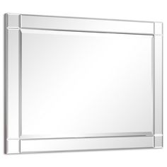 a large mirror on the wall with a white background