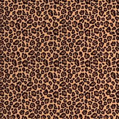 an animal print fabric with brown and black spots on the front, along with a ruler