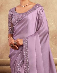 COLOR : Mauve FABRIC : Saree - Satin Silk, Blouse - Satin Silk & Net WORK : Resham Embroidery, Stones, Sequins, Lace BorderOCCASION : Wedding, Engagement, Party Wear, Festival, Sangeet NOTE : The outfit includes blouse and saree only. Petticoat is not included. READY-TO-WEAR : No STITCHING : Available as semi-stitched fabric, can be stitched using standard size option (+$30). Note: There might be a slight color variation due to lighting and flash used during photoshoot. The bright shade seen is the best closer view of fabric's color. Mauve Wedding Party, Embroidery Stones, Saree Satin, Mauve Fabric, Blouse Satin, Resham Embroidery, Mauve Wedding, Wedding Party Wear, Party Wear Saree