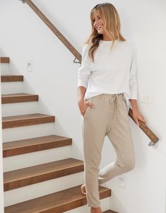 DESCRIPTION Effortlessly chic and endlessly versatile, the Sunset Throw On Lounge Pant in Stone is your new everyday essential. Crafted from premium heavy-weight cotton slub fabric, milled exclusively for White & Co., these full-length pants offer a flattering relaxed fit that’s both comfortable and stylish. The soft, neutral Stone hue pairs beautifully with any wardrobe and is perfect for year-round wear. Designed with an elastic waistband and adjustable drawstring, they’re as practical as they are fashionable, making them ideal for lounging, casual outings, or travel. Team these lounge pants with a classic white tee and sneakers for a timeless, laid-back look, or style them with a linen shirt and slides for an elevated weekend outfit. Still browsing? Discover our full range of women's cl Neutral Stone, Travel Team, Weekend Outfit, Adjustable Waistband, White Tee, Lounge Pants, The Sunset, Classic White, Linen Shirt