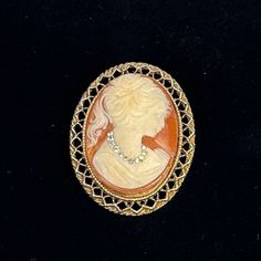 This is a beautiful vintage cameo brooch with an unusual rhinestone necklace. Retro Cameo Jewelry For Formal Occasions, Vintage Cameo Brooches For Vintage Events, Formal Retro Cameo Jewelry, Vintage Oval Rhinestone Jewelry, Antique Cameo Medallion Brooch, Classic Oval Cameo Brooch, Antique Gold Cameo Brooch, Collectible Cameo Pendant Brooches, Gold Cameo Brooch Collectible