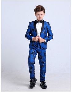 PRODUCT DESCRIPTION Meant for the Gala, this 4-piece South Florida inspired suit will turn heads. Your next social celebration, Le Petit Gentlemen in your life will be looking suave and sophisticated. Our stylish, sleek design Miami Midnight Tuxedo comes with the signature jacket and trousers, matching vest, and a brilliant white shirt to contrast this suit bejeweled black bowtie. All 4 pieces are tailored in modern styling, tapering at the waist and staying slim while also maintaining comfort t Tailored Spring Party Tuxedo, Tailored Long Sleeve Party Sets, Blue Tuxedo Three-piece Suit For Party, Tailored Tuxedo Party Sets, Elegant Slim Fit Spring Sets, Fitted Tuxedo Sets For Parties, Spring Party Blue Suits, Elegant Slim Fit Long Sleeve Sets, Elegant Long Sleeve Slim Fit Set