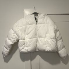 H&M White Puffer Jacket With Hood. Size L Never Worn But Opened Packaging. Shell - 100% Recycled Polyester Lining - 100% Recycled Polyester Padding - 100% Recycled Polyester Trendy H&m Outerwear, White Puffer Jacket With Detachable Hood For Fall, Oversized White Puffer Jacket For Spring, White Puffer Jacket With Pockets For Spring, White Adjustable Hood Outerwear For Fall, Trendy H&m Outerwear For Streetwear, White Spring Outerwear With Detachable Hood, H&m Casual Winter Outerwear, Spring White Outerwear With Detachable Hood