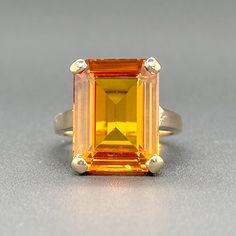 FREE Ring Sizing on this item. Up or Down up to 2 full sizes are complimentary on the purchase of this Ring. Simply request size adjustment in buyer notes._____________________________________________________________________________ This Estate 14K Yellow Gold 8.87ct Citrine Cocktail Ring will be the bee's knees of your jewelry box! Everything from it's eye-clean 8.87ct emerald cut citrine to the luxurious 14K yellow gold will have your friends green with envy. And, with a size 6 design that can Luxury Yellow Gold Rings With Lab-created Sapphire, Sapphire Cocktail Ring, Bee's Knees, Orange Sapphire, Cocktail Ring, Cocktail Rings, Emerald Cut, Yellow Color, Citrine