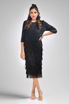 Black fitted dress in a textured base with layered fringed detailing. - Aza Fashions Elegant Fringe Dresses For Formal Occasions, Chic Knee-length Midi Dress With Fringe, Chic Knee-length Fringe Midi Dress, Elegant Fringe Midi Dress For Evening, Elegant Cocktail Midi Dress With Fringe, Elegant Midi Dress With Tassels For Night Out, Elegant Tasseled Midi Dress For Night Out, Elegant Tassel Midi Dress For Night Out, Chic Fringe Midi Dress For Evening