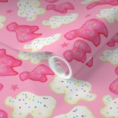 a pink wallpaper with cookies and stars on it