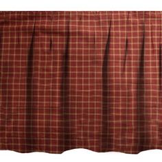 a red and white checkered bed skirt with ruffled hems on the bottom