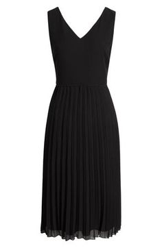 Designed in a sleeveless silhouette, this day-to-night dress is punctuated with a pleated chiffon skirt. 46" length (size 8) V-neck Sleeveless Lined 100% polyester Dry clean Imported Elegant A-line Sleeveless Dress With Pleated Hem, A-line Pleated Dress For Date Night, Elegant Black Pleated Dress, Black Sleeveless Dress With Accordion Pleats, Chic Sleeveless Dress With Pleated Back For Work, Black Pleated Skirt Dress For Evening, Sleeveless Dress With Accordion Pleats For Evening, Sleeveless Evening Dress With Accordion Pleats, Black Evening Pleated Dress With Pleated Skirt