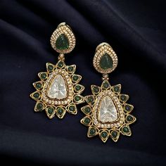 Channel the allure of Indian traditions with our Kundan and Polki Earrings. Inspired by the rich heritage of Indian jewelry, these pieces evoke the essence of timeless beauty. Creation Process: Meticulously crafted, each piece narrates a story of skilled artisans dedicating hours to bring forth the intricate details. From selecting the finest materials to hand-setting each stone, our process ensures a masterpiece. designed for those who appreciate cultural elegance, these earrings complement var Traditional Dangle Clip-on Earrings For Formal Occasions, Traditional Clip-on Earrings For Festive Occasions, Fusion Style Drop Bridal Earrings For Celebration, Green Fusion Style Earrings For Celebration, Green Jeweled Fusion Earrings, Green Fusion Earrings For Celebration, Fusion Style Bridal Drop Earrings For Celebrations, Formal Jeweled Earrings For Festivals, Fusion Style Earrings With Intricate Design For Celebration