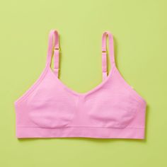 BACK AND BETTER THAN EVER! Our Tulip Bra is updated with softer and slightly thicker fabric. We added gentle ruching to allow room and support for development and growing girls. The Tulip bra is a fantastic option for all girls in search of an everyday, blissfully soft and comfortable addition to their top drawers. Like any seamless bra we make, they're created to be so comfortable you'll forget you have it on - it's like wearing air!The Tulip Braisour original Basics Collection Bra. This means Soft Touch Summer Bra In Solid Color, Solid Color Soft Touch Bra For Summer, Summer Bra With Soft Touch, Summer Soft Touch Solid Color Bra, Summer Stretch Seamless Bra, Spring Bra With Light Support And Stretch, Spring Stretch Bra With Light Support, Seamless Solid Bra For Spring, Solid Seamless Bra For Spring