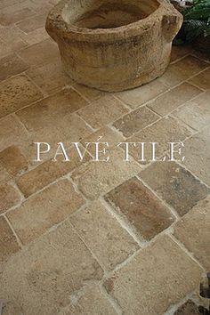 a planter sitting on top of a stone floor