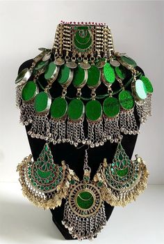 Afghan full green antique jewellery set, Afghan Jewellery Vintage Kuchi Choker Necklace, Afghan Jewellery, Afghan Fashion  Set includes:  -oversized tikka -chocker necklace  -oversized earrings  Message for any enquiries Our Aim as a business is to connect Afghan women with their roots and to make anyone that purchases our jewellery feel powerful and beautiful as each and everyone of our items is handcrafted with care and love. Green Metal Jewelry Sets For Wedding, Green Festive Ceremonial Jewelry, Festive Green Ceremonial Jewelry, Ornate Green Jewelry For Festive Occasions, Bohemian Green Jewelry For Festive Occasions, Green Ceremonial Jewelry Set For Festive Occasions, Green Metal Jewelry For Festivals, Green Festive Jewelry Set For Ceremonial Occasions, Festive Green Jewelry Set For Ceremonial Occasions