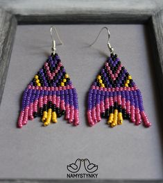 These violet purple seed bead earrings are made of high-quality Czech beads and strong synthetic thread. They are elegant, fashionable, and highly versatile, suitable for everyday wear. Features: Sterling silver components Color: pink, violet, yellow, black. This item is currently in stock. You must be completely satisfied. If you find merchandise unsatisfactory for any reason, return it within 10 days and your money will be refunded without questions. These earrings in blue and pink color https Purple Beaded Earrings With Colorful Beads, Purple Beaded Dangle Earrings With Black Beads, Purple Dangle Beaded Earrings With Black Beads, Purple Dangle Earrings With Black Beads, Purple Beaded Earrings With Dangling Round Beads, Handmade Traditional Purple Beaded Earrings, Traditional Handmade Purple Beaded Earrings, Traditional Purple Beaded Earrings For Festivals, Purple Beaded Dangle Earrings With Tiny Beads