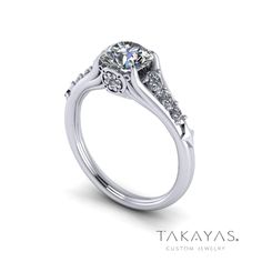 a white gold engagement ring with diamonds on the side