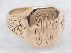 This antique signet ring has a lovely refined look to it. The sweet daisy flowers along the shoulders give just enough texture to draw the eye, without being ostentatious. We've left the original monogram "M" done in beautiful French Script. Please note that this signet ring has its original monogram, unfortunately, this piece cannot be altered without affecting the quality of the piece, please feel free to contact us to help you find your perfect signet ring in your style and budget! Metal: 14K Antique Rose GoldTop Measurements: 12 x 9 mm, Rectangle Monogram: "M" in French ScriptRing Size: 4Marks: "14K" Stamped on the inside band French Script, Daisy Flowers, Antique Roses, Daisy Flower, Signet Ring, The Eye, Your Perfect, Daisy, Finding Yourself