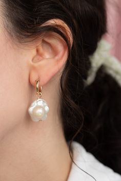 These daisy shaped freshwater pearl earrings are a unique spin on the classic Baroque pearl drops — Each set of pearls are different and won't look exactly like the ones pictured due to the nature of freshwater pearls. Choose from the drop-down menu if you want 14k gold-filled huggies hoops included, or just the charms alone. Each item is made-to-order. Please allow a processing time of 14 business days. We value your patience and appreciation of the handmade process! Baroque Pearl Drop Hoop Earrings, Freshwater Pearl Earrings, Freshwater Pearls Earrings, Earring Sale, Pearl Drop, Baroque Pearls, Earring Necklace, Jewelry Care, Ring Necklace