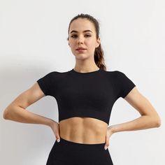 Made with lightweight, breathable, and moisture-wicking fabric, this Women's Sportwear Short Sleeve Gym Top is perfect for when you want to stay comfortable while exercising. It features seamless construction for a smooth feel and effortless layering options. This top is a must-have for any active woman. Designed by 4COLORDRESS