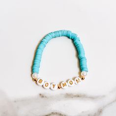 "Introducing our exquisite Blue Beaded \"Boy Mom\" Bracelet, a lovingly handcrafted piece that beautifully embodies the pride and joy of being a boy mom. This bracelet features an array of brilliant blue beads, each carefully chosen for its vibrant hue and striking beauty, making it a meaningful and stylish accessory for any occasion. 🍼The \"Boy Mom\" charm is the heart of this piece, a heartfelt declaration of the special bond you share with your sons. This bracelet is not just jewelry; it's a reflection of the love, support, and connection that make being a boy mom a truly unique and wonderful experience. 👶🏽Whether you're celebrating your role as a boy mom, commemorating a milestone, or simply adorning your wrist with a symbol of your love, this bracelet is a perfect choice. Each bead Adjustable Blue Name Bracelet With Colorful Beads, Blue Name Bracelet For Mother's Day Gift, Blue Name Bracelet With Colorful Beads As Gift, Adjustable Turquoise Birthday Bracelet, Mother's Day Blue Name Bracelet Gift, Personalized Blue Bracelet For Mother's Day, Blue Round Beads Name Bracelet For Birthday, Customizable Blue Name Bracelet With Round Beads, Blue Round Beads Bracelets For Mother's Day