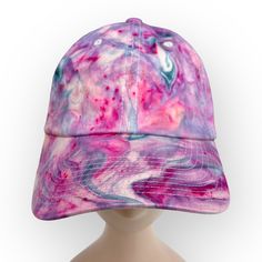 Hand-Dyed Colorful Pink & Blue Marble Dye Adjustable Baseball Cap This one-of-a-kind baseball cap has been marble dyed to create a colorful organic pattern. The hat was dyed using professional fiber reactive Procion fabric dyes, so the color will stay permanent and vibrant. Item Details: - Flexfit Baseball Cap/ Hat - Adjustable Adult Size L/XL - Adjustable Elastic Band - Contrast Stitching - Permacurv Visor - 98% Woven Cotton / 2% Spandex - Prewashed and Preshrunk - Hat Sizing: 7-1/8" - 7-5/8" - Multicolor Adjustable Baseball Cap With Curved Bill, Multicolor Curved Bill Baseball Cap, Casual Multicolor Fitted Hat With Curved Brim, Casual Multicolor Curved Brim Fitted Hat, Blue Baseball Cap For Beach, Multicolor Baseball Cap With Curved Brim, Multicolor Curved Brim Baseball Cap One Size, Multicolor Curved Brim Baseball Cap, Multicolor Adjustable Fitted Hat With Curved Brim