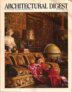 a woman sitting on top of a couch in a living room