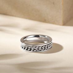 Made from high-quality 925 sterling silver, this band perfectly combines style with function. The rotating design adds a fun element to this band. Each turn symbolizes the memories and experiences that have shaped you into the extraordinary individual you are today. Wear this band with pride. Because it represents your commitment to embracing life’s journey and cherishing the moments that matter most.Weight: 4 gWidth: 5 mmHeight: 2.3 mmThickness: 2 mmMaterial: 925 SilverPlating Color: Silver Modern Stackable Stainless Steel Jewelry, Silver Double Band Jewelry With Modern Twist, Modern Twist Silver Double Band Jewelry, Silver Stackable Jewelry With Thick Band, Modern Silver Chain Ring For Gift, Stainless Steel Chain Jewelry For Anniversaries, Modern Silver Promise Chain Ring, Silver Open Band Promise Jewelry, Sterling Silver Chain Ring In Silver