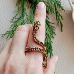 Ring made of gold beads in the shape of a snake. Unusual stylish handmade accessory. good gift. Ring in the shape of a snake talisman for financial success Symbolic Gold Snake Jewelry, Spiritual Metal Jewelry In Snake Shape, Adjustable Symbolic Snake-shaped Jewelry, Spiritual Snake-shaped Metal Jewelry, Spiritual Brass Snake-shaped Jewelry, Adjustable Metal Snake Ring, Spiritual Brass Jewelry In Snake Shape, Adjustable Gold Snake-shaped Jewelry, Adjustable Brass Snake-shaped Jewelry