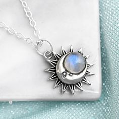 Sun and moon face Necklace with Moonstone gem. Genuine gemstone. Made of sterling silver. Metal: Solid sterling silver Pendant size: 20mm Necklace length: 44-48cm Gemstone: Rainbow Moonstone Gemstone color: White ✈ Free Shipping (USPS) 🎁 Free Gift Box ↻ 60 Days Return ⌛ 24 Handling Time ** GET 15% OFF COUPON ** Visit 👉 boho-magic.com/join Join and get coupons, exclusive offers, updates, and more surprises! ** ALSO IN OUR SHOP ** Shop▸ https://etsy.me/2rT0tbC Most Loved▸ https://etsy.me/2AcpzH2 Silver Pendant Jewelry With Sun And Moon Design, Sterling Silver Sun And Moon Pendant Charm Necklace, Sterling Silver Charm Necklace With Sun And Moon Design, Sterling Silver Pendant Necklace With Sun And Moon Design, Silver Celestial Moonstone Necklace, Celestial Silver Moonstone Necklace, Silver Crescent Gemstone Necklace, Spiritual Moon Shaped Silver Jewelry, Spiritual Silver Moon Jewelry