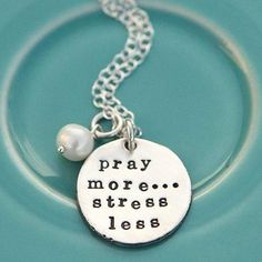 This hand-sculpted fine pewter pendant necklace is inscribed with the words "Pray More, Stress Less". May this uplifting necklace serve as a peaceful reminder to bring your worries to Christ and leave the stress behind. The pendant is sweetly accented with a freshwater pearl. Pendant Diameter: 7/8"  Coordinating Chain: Inspirational Nickel-free Silver Necklace, Inspirational Nickel-free Charm Necklace For Mother's Day, Everyday Spiritual Nickel-free Charm Necklaces, Inspirational Adjustable Nickel-free Charm Necklaces, Adjustable Inspirational Nickel-free Charm Necklace, Personalized Silver Necklace For Meditation, Nickel-free Spiritual Charm Necklaces For Everyday, Meaningful Silver Nickel-free Necklaces, Nickel-free Meaningful Silver Necklace