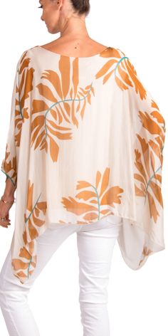 100% Silk Kaftan Style Blouse with Large Leaf Print. Features 3/4 Length Sleeves and a Wavy Bottom. Exterior: 100% Silk Interior: 95% Viscose, 5% Elastic Fits Sizes XS- XL Made in Italy Vacation Rayon Blouse With Relaxed Fit, Relaxed Fit Rayon Blouse For Vacation, Versatile Spring Blouse For Vacation, Versatile Spring Vacation Blouse, Summer Beach Tunic In Viscose, Beach Tunic Top In Rayon, Spring Beach Viscose Tunic, Spring Beach Tunic Made Of Viscose, Summer Rayon Tunic