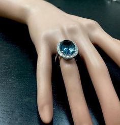 13.20 Carats Natural Impressive LONDON BLUE TOPAZ and Diamond 14K White Gold Ring Suggested Replacement Value $7,300.00 Total Natural London Blue Topaz Weight: 12.00 Carats London Blue Topaz Measures: 16.00 x 12.00mm Natural Round Diamonds Weight: 1.20 Carats (color G / Clarity SI1) Ring total weight: 8.4 grams Disclaimer: all weights, measurements and colors are approximate and may vary slightly from the listed dimensions or as seen in the image. All pictures are magnified to show the smallest Luxury Round Gemstones For Formal Occasions, Luxury Round Gemstones For Formal Events, Luxury Diamond Gemstones For Formal Occasions, Luxury Round Gemstones With Diamond Accents, Elegant Topaz Ring With Gemstone Accents For Anniversary, Luxury Diamond Ring With Gemstone Accents For Anniversary, Luxury Blue Diamond Ring With Accents, Luxury Topaz Ring With Diamond Accents, Elegant Diamond Topaz Ring