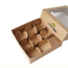 an open cardboard box filled with paper hearts