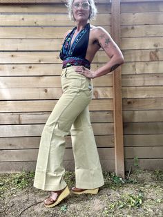 Ugh these are so great  Women's vintage 1970's khaki flared/bellbottom trouser pants  Zip up button fly  Adorable fish and snail patch on back pockets  Front pockets  Great vintage condition  With some small stains one at top of pocket  One on pant leg and another on bottom pant leg  Photos reveal all stains  Fits like a medium  Measurements taken flat are double waist and hips for more accurate sizing  Waist: 14.5 in  Hips: 19 in  Inseam: 29 in  Rise: 13 in.  Length:  All sales are final  Thank Retro Cotton Wide Leg Pants, Fitted Vintage Wide Leg Pants For Spring, Vintage Wide Leg Summer Pants, Retro Wide Leg Flares For Spring, Vintage Fitted Wide Leg Bottoms, Vintage Wide Leg Fitted Bottoms, Vintage Wide Leg Bottoms, Retro Fitted Wide Leg Pants, Vintage High Waist Spring Flares