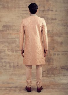 Featuring this Peach Blush colour Sherwani in Resham embroidery. This Sherwani set is fully embroidered with monotone colour Resham and collars are hand-embroidered in silver colour. It can be paired with Slim Trousers as well. Perfect fit for any wedding function. Brand: Panache Haute Couture Availability: Online and In-store Delivery Time: 4-6 Weeks Fabric: Sherwani - Silk and Bottom (Churidaar) - Lycra Satin or Trouser - Raw Silk Customisation: For more colour options please contact our team Peach Color Sherwani For Groom, Pink Chanderi Long Sleeve Sherwani, Pink Semi-stitched Sherwani With Intricate Embroidery, Peach Sherwani, Luxury Semi-stitched Chinon Sherwani, Resham Embroidery, Peach Blush, Slim Trousers, Wedding Function