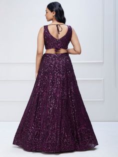 Introducing the wonderful purple sequins georgette party wear lehenga choli, an exquisite ensemble that is sure to make a statement at any special occasion. This stunning lehenga choli features a purple color georgette material with intricate sequin and thread embroidery work, creating a beautiful and captivating design.
This lehenga choli is its versatility. It is perfect for a range of events, including engagements, receptions, and parties. Its vibrant purple color adds a touch of elegance and Purple Georgette Dress With Sequins, Purple Sequined Georgette Dress, Sequin Lehenga For Reception & Party Season, Glamorous Party Lehenga With Pallu, Purple Sharara For Reception And Navratri, Party Choli With Sequins In Georgette, Semi-stitched Sequin Lehenga For Parties, Semi-stitched Sequined Lehenga For Party, Party Lehenga In Georgette