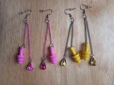 These cute and useful earrings double as hearing protection! Two chains dangle from each ear hook, one has a teardrop shape gem charm and the other has an earplug. Look stylish and protect your ears with this multipurpose fashion accessory!  Available in different color and bead options: 1. Pink Earplug with Pink Color Chain and Pink Gem 2. Yellow Earplug with Silver Color Chain and Yellow Gem They hang about 4 inches from the earlobe on stainless steel ear hook. These can be made with Stainless Earplug Earrings, Silicone Ear Plugs, Yellow Gems, Earrings Double, Jewelry Cute, Hearing Protection, Pink Gem, Festival Jewelry, Ear Plugs