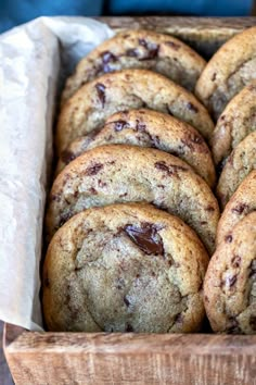 chocolate chip cookies are in a wooden box