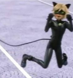 a catwoman is running on the ground