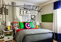 a bedroom decorated in green, white and red with a captain's shield on the wall