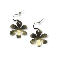 These brushed textured brass earrings add a pop to any outfit. Drop earrings with a simple flower shape. Springtime are in the air. Details: Hook fastenings for pierced ears. Size: Length of drop: ~ 1.6" (4 cm), widest portion: ~ 1.2" (3 cm) Material: brass, silver plated brass Modern Metal Earrings For Spring, Silver Flower-shaped Brass Earrings, Metal Flower Earrings With Flower Charm, Brass Dangle Flower Earrings, Chic Metal Flower Earrings, Metal Drop Earrings With Flower Charm, Brass Drop Earrings With Flower Charm, Metal Flower Charm Drop Earrings, Silver Brass Flower-shaped Earrings