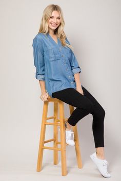 Description This Chambray Shirt is classic in design and features a split v-neck and roll up sleeves. The back is a tad longer and provides perfect coverage with leggings. It has soft, buttery fabric making it perfect for layering in every season. A must-have to level up your layering game. Also ideal for wearing as is. Tuck it in for the perfect work look or wear it casually with dark pair of denim. All About the Fit Fabric Feel (light) 1 2 3 4 (heavy) Fit (slimfit) 1 2 3 4 (loosefit) Fabric De Chambray Shirt Outfits, Work Looks, Roll Up Sleeves, Chambray Shirt, Light Denim, Yoga Women, In Design, Denim Shirt, Roll Up