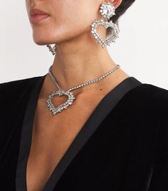 Find ALESSANDRA RICH Crystal Heart Clip-on Earrings on Editorialist. The gleeful feeling of getting ready for an evening out inspired Alessandra Rich to create her namesake label, a brand that fearlessly celebrates femininity. Large jewels and unabashed designs are a given, which is exactly what the Crystal Heart earrings bring to the table, acting as a final touch to complete any eveningwear ensemble. Heart Cut Charm Jewelry For Party, Heart Cut Jewelry With Heart Charm For Party, Party Jewelry With Heart Cut Charm, Heart Pendant Diamond Jewelry For Party, Diamond Heart Pendant Jewelry For Party, Diamond Heart Pendant For Party, Dazzling Jewelry For Valentine's Day Party, Luxury Heart-shaped Jewelry For Party, Fine Jewelry Heart-shaped For Parties