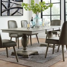 a dining room table with chairs around it