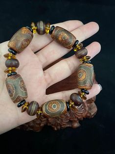 African Beaded Bracelets, Three Eyes, Dope Jewelry Accessories, Bead Tips, Beads Craft Jewelry, Earthy Jewelry, Bracelets Design, Wooden Bracelet, Bracelet Display