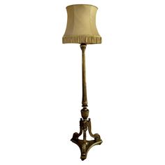 a floor lamp with a beige shade on it's base and a white background